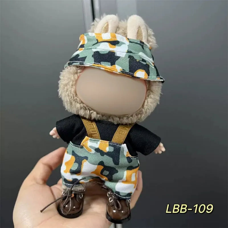 Plastic doll clothing costume for 17cm tall vinyl figurines on a display stand.