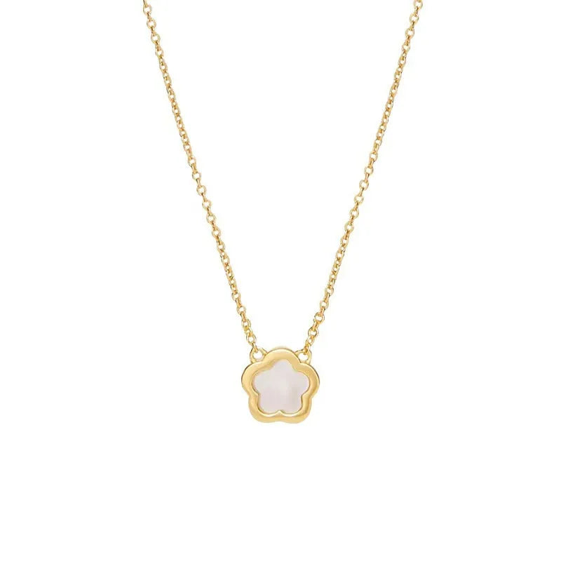 White mother shell flower necklace with floral pendant on gold or silver chain.
