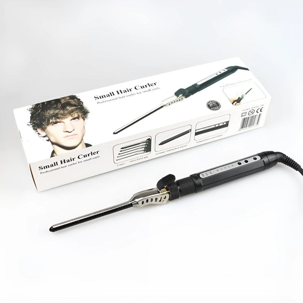 Black 7mm small hair curler with rotatable clip on a flat surface