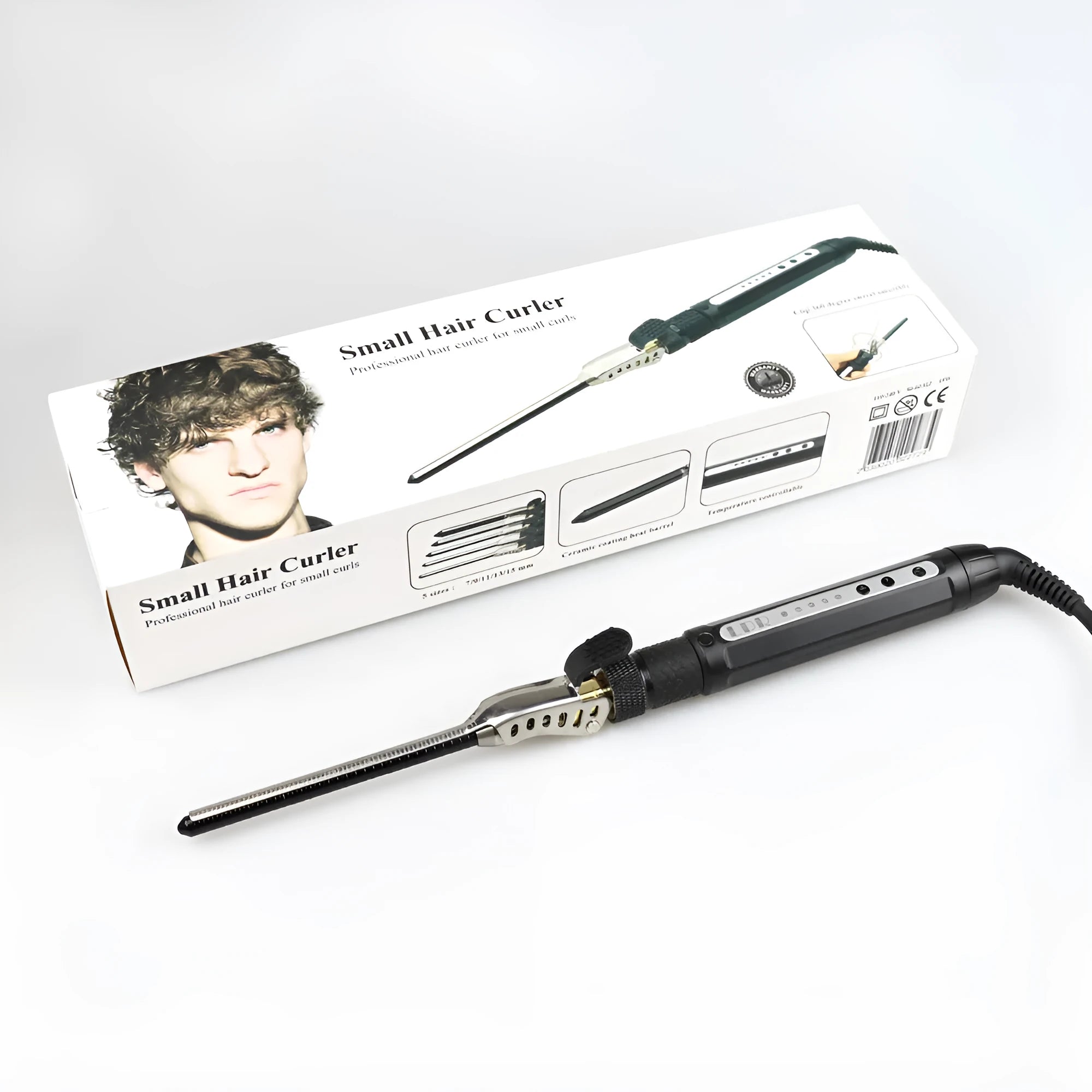 Black 7mm small hair curler with rotatable clip on a flat surface