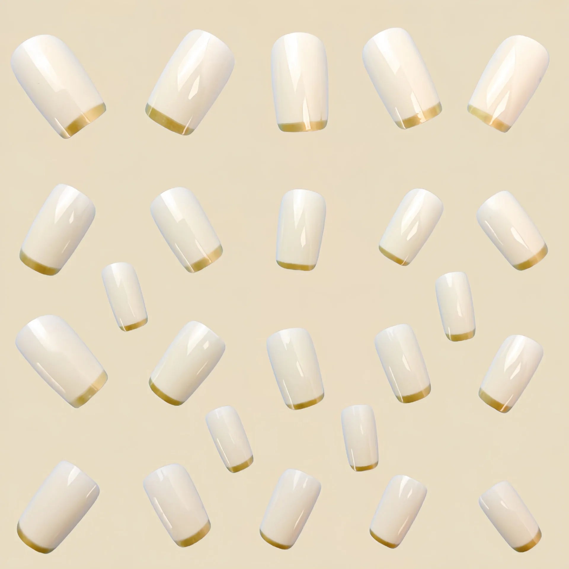 Mid-length European square nail art patch with white French tip and golden edge on a natural nail