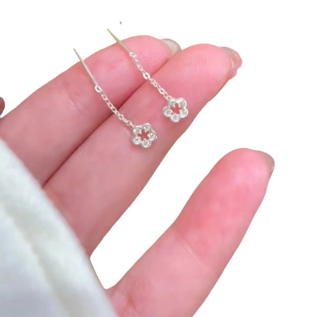 Sterling silver hollow flower hanging earrings with petal detailing and alloy construction