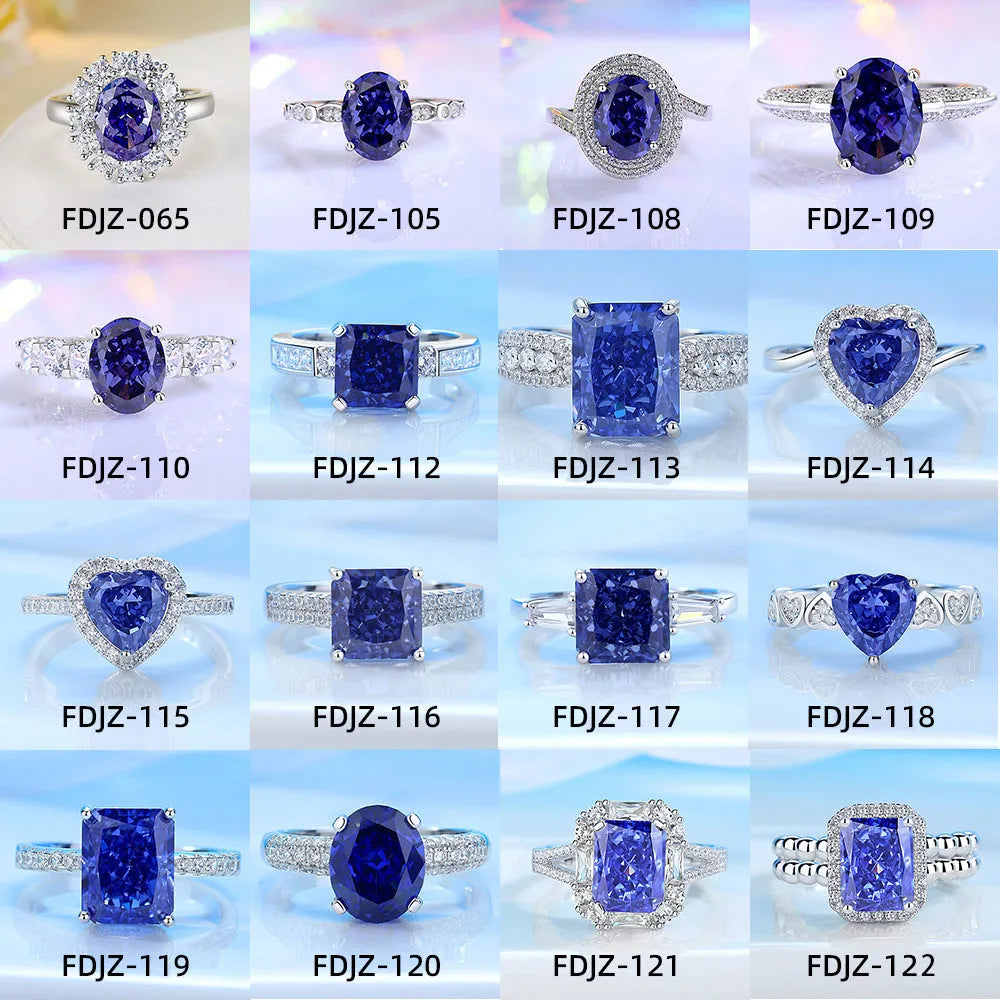 Women's heart-shaped sterling silver ring with ice flower cut coloured zircon stone on finger.