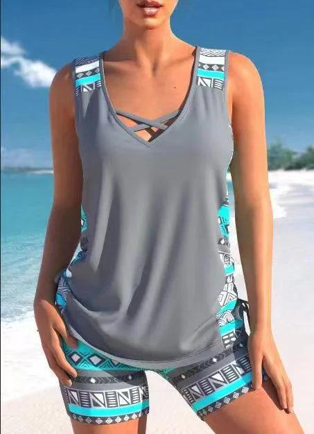 Women's blue printed lace two-piece swimsuit top and shorts laid flat.