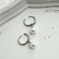 Pearl drop earrings with geometric alloy shape and titanium steel posts