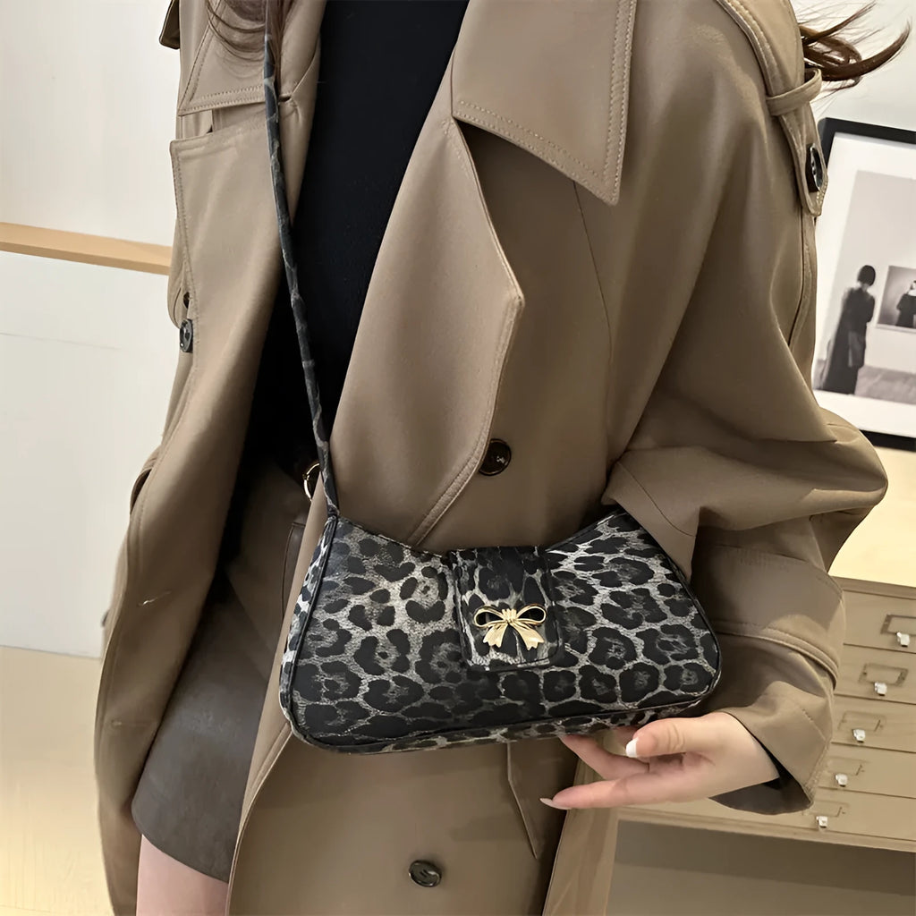Women's large capacity casual PU handbag in black with sandwich pocket exterior design