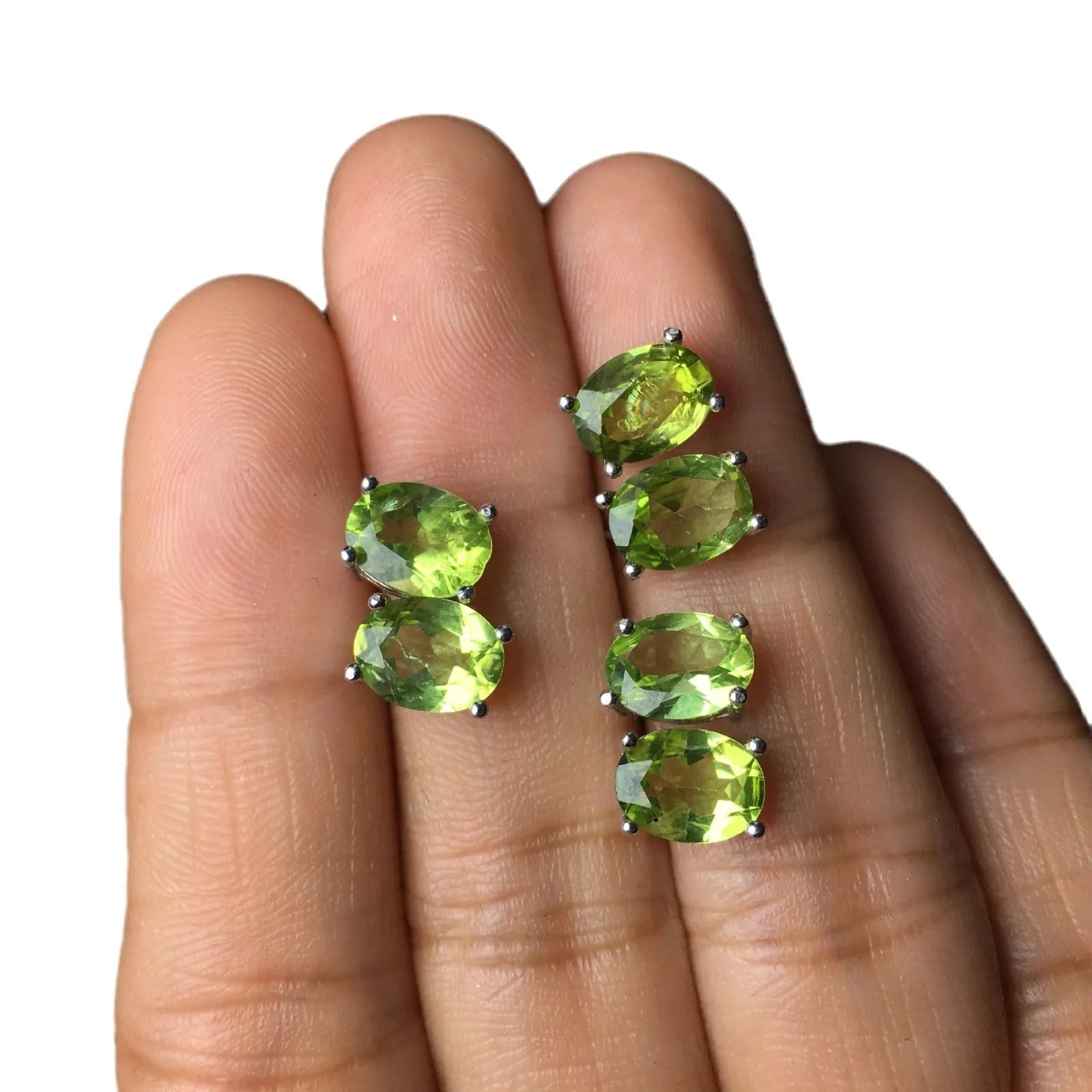 Natural olivine faceted stud earrings in S925 sterling silver with 6 × 8mm grass green oval stone