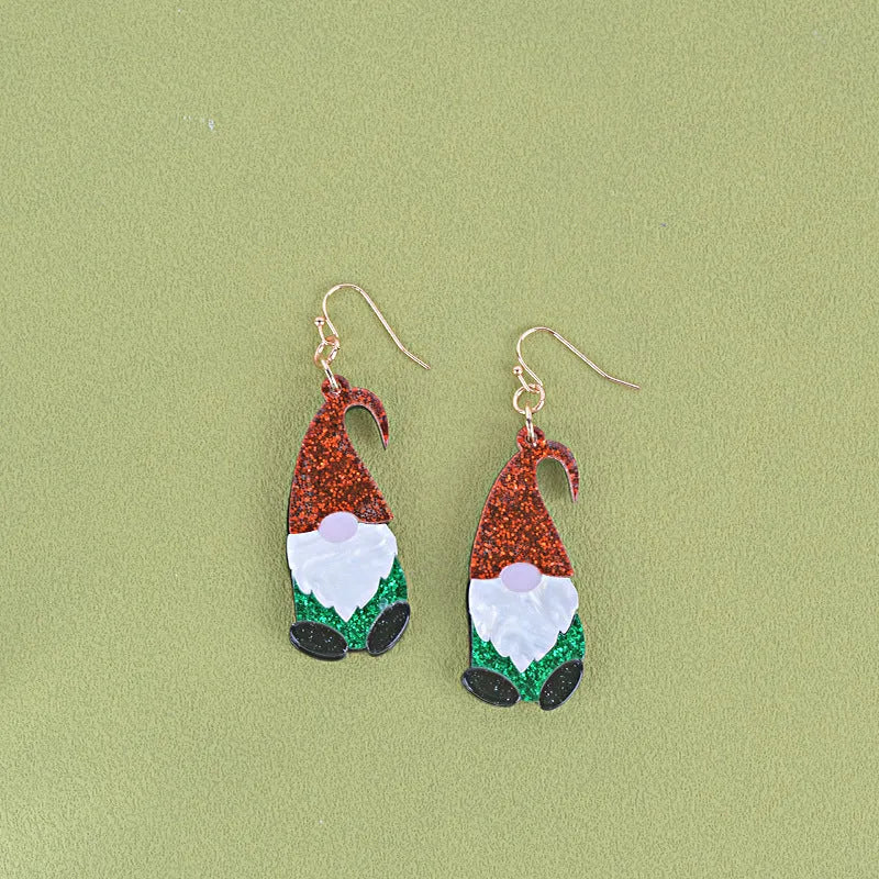 Pair of cartoon Santa Claus acrylic earrings in red and green hat style.