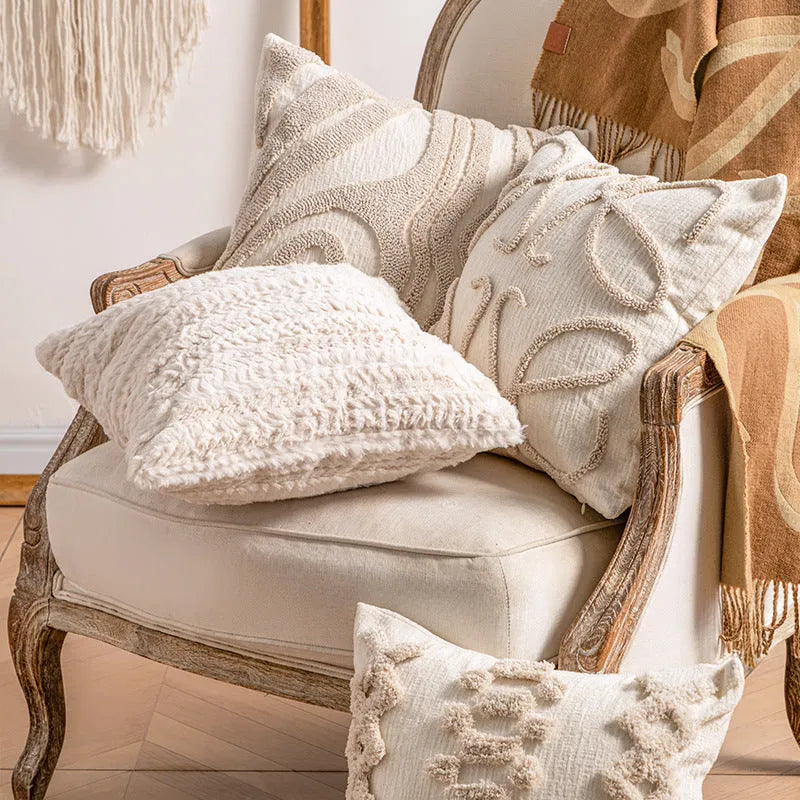 Knitted sofa cushion cover with tassel detail and striped pattern in spiral dots colour design