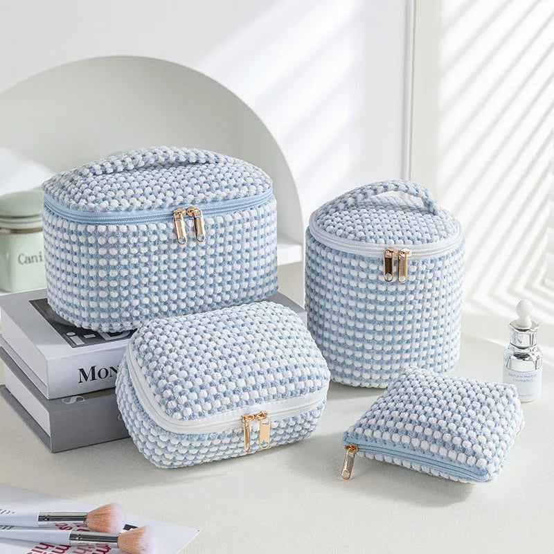 Four-piece flannelette makeup bag set in cube style design with polyester material