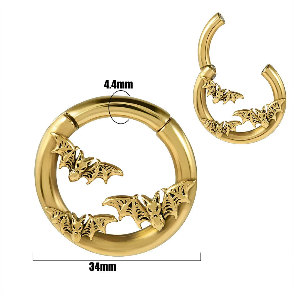 A pair of silver fashion earrings featuring a detailed totem pattern design on a stainless steel base.