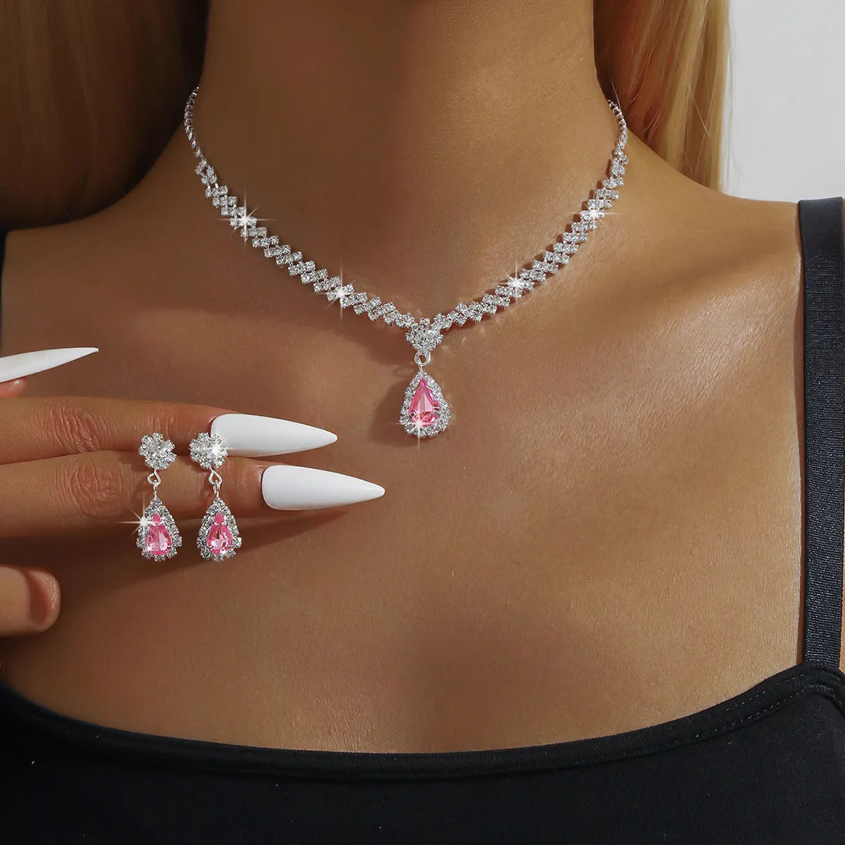 Claw chain necklace and matching earrings set with drop-shaped rhinestones in multiple colour options