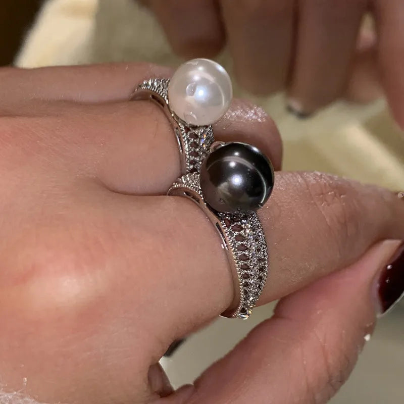 Geometric copper open band ring for women with a black pearl and adjustable opening.