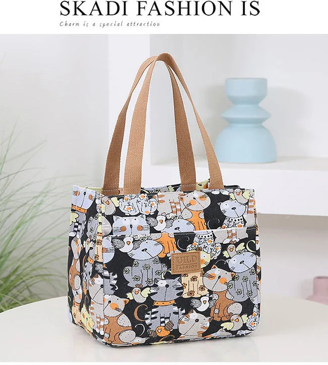 Women's printed canvas tote bag with aluminium frame showing horizontal square shape and floral pattern design