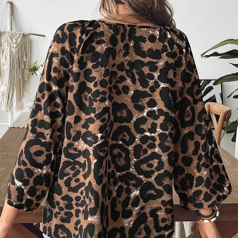 Women's leopard print half sleeve V-neck pullover top in multicolor pattern