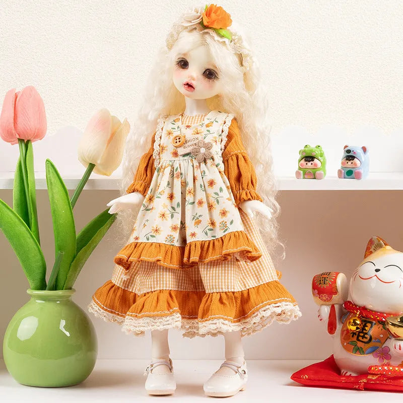 Printed cloth doll clothes for fashion dolls in various colourful patterns sold separately without dolls