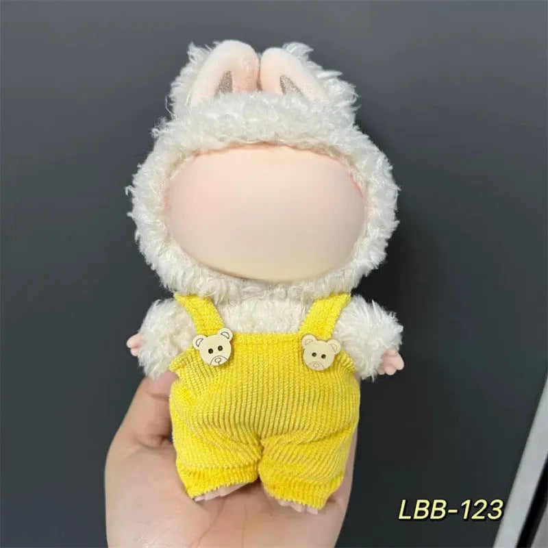 Plastic doll clothing costume for 17cm tall vinyl figurines on a display stand.