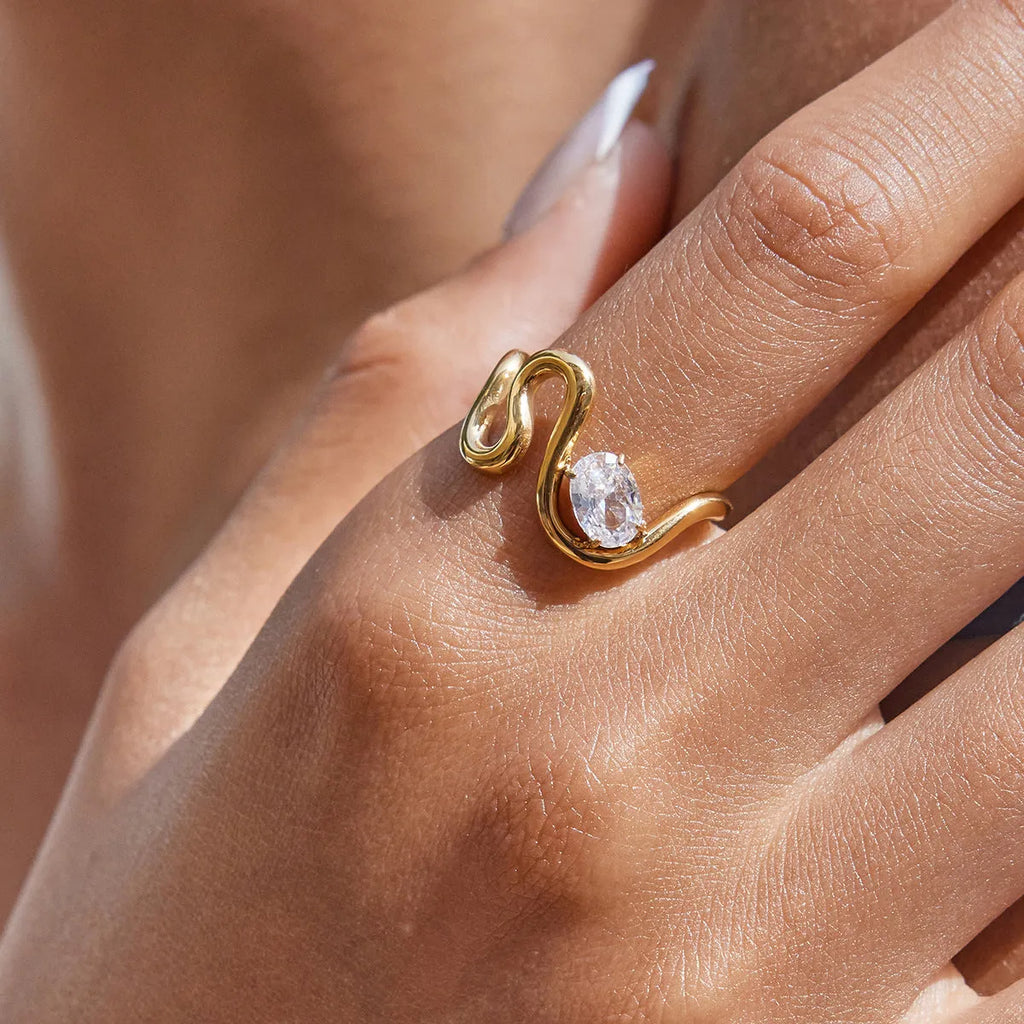 Geometric stainless steel zircon ring in European style on a grey background.