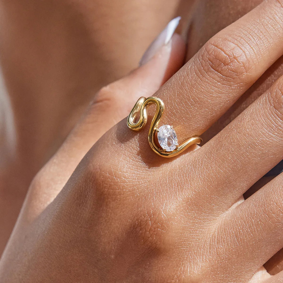 Geometric stainless steel zircon ring in European style on a grey background.