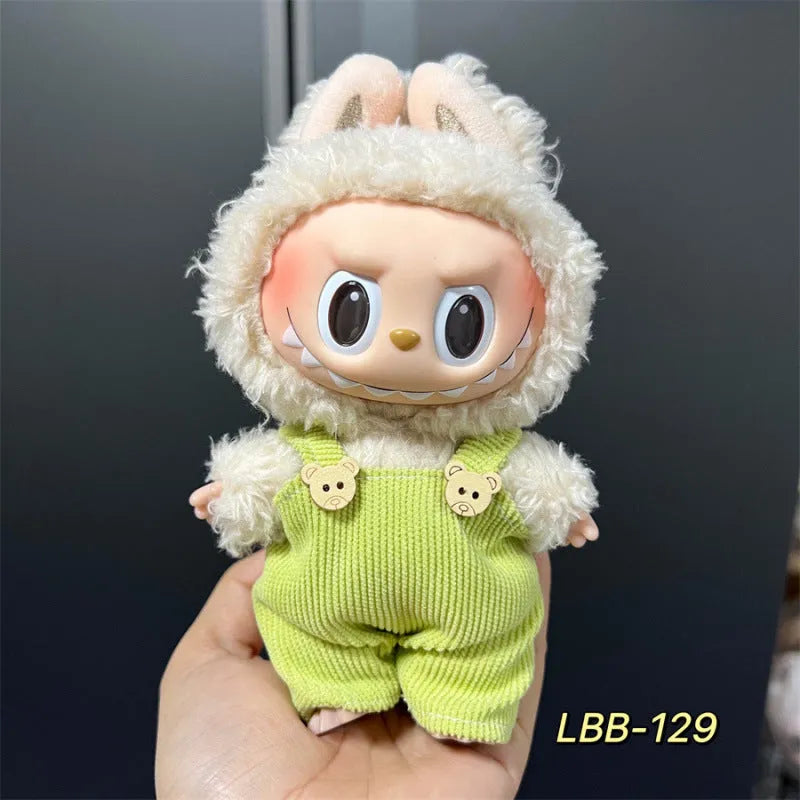 Plastic doll clothing costume for 17cm tall vinyl figurines on a display stand.