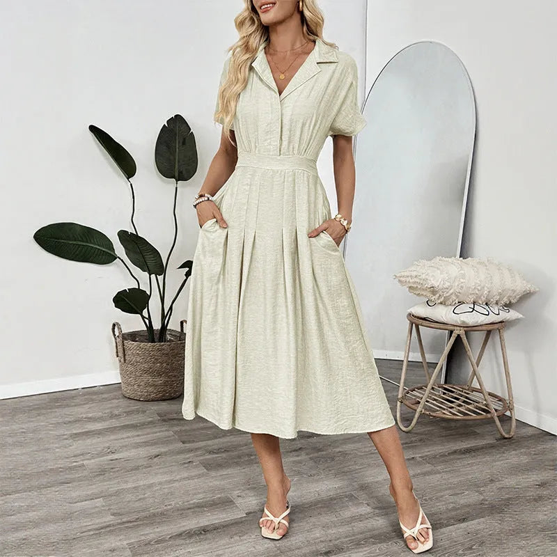 Light green women's shirtdress with lapel collar, waist tie, and side pockets.
