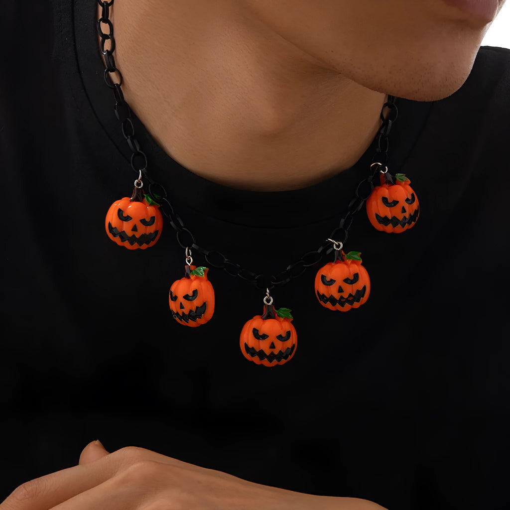 Halloween necklace with ghost and pumpkin cartoon pendants on a chain, in mixed colours.