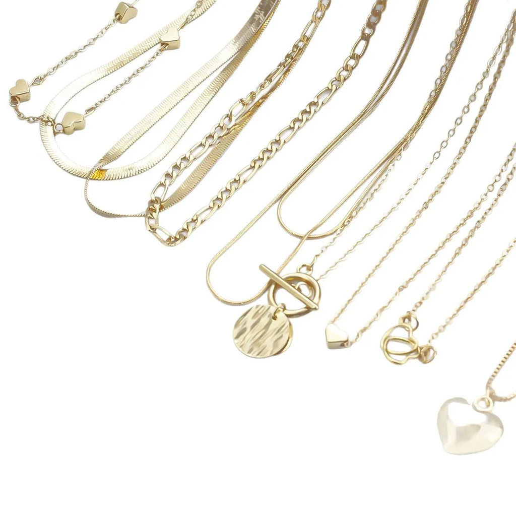 Ten gold necklaces with alloy pendants on adjustable snake bone chains in a women's jewellery set