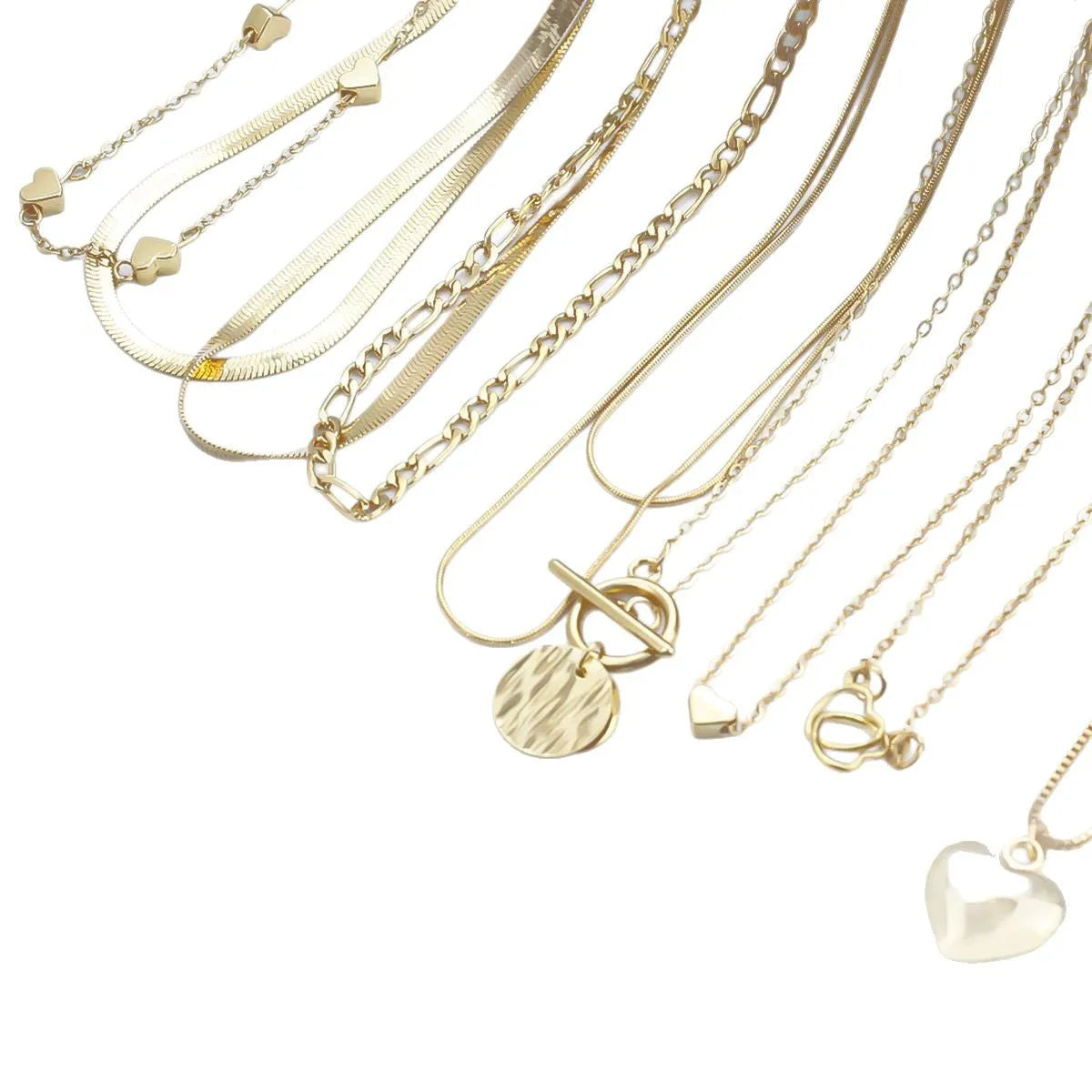 Ten gold necklaces with alloy pendants on adjustable snake bone chains in a women's jewellery set