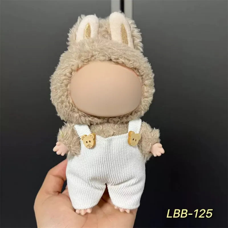 Plastic doll clothing costume for 17cm tall vinyl figurines on a display stand.