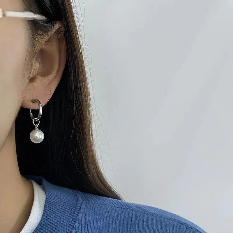 Pearl drop earrings with geometric alloy shape and titanium steel posts