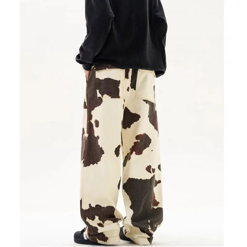Men's straight-leg casual trousers with a retro-style cows print pattern on a cotton-polyester fabric.