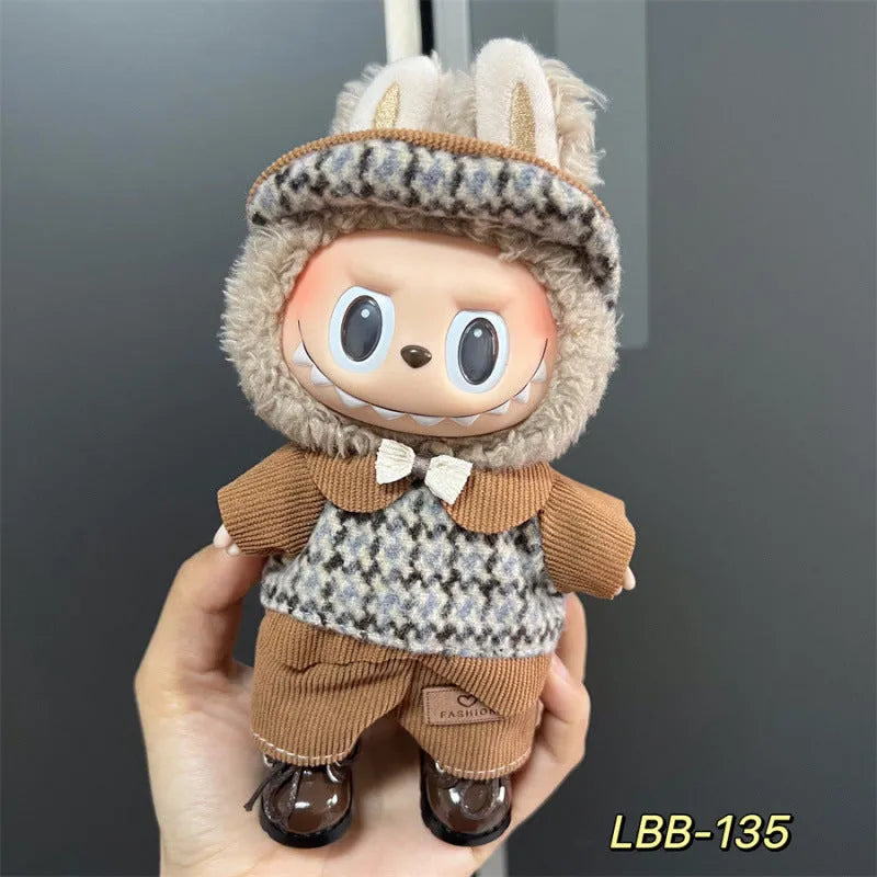 Plastic doll clothing costume for 17cm tall vinyl figurines on a display stand.