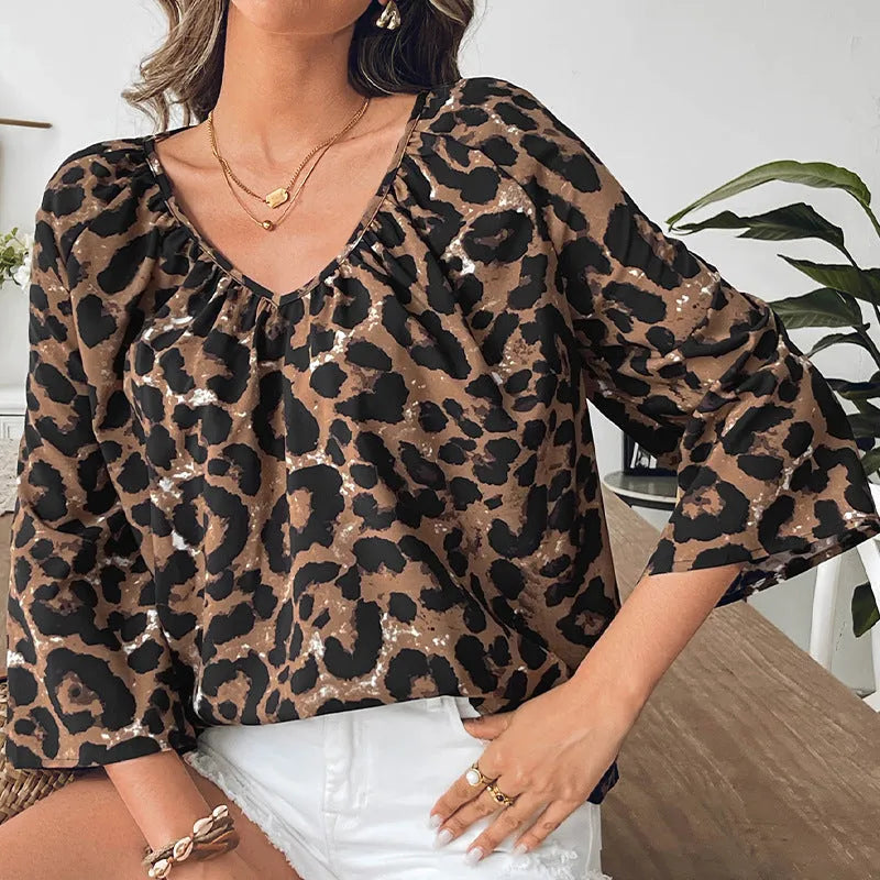 Women's leopard print half sleeve V-neck pullover top in multicolor pattern