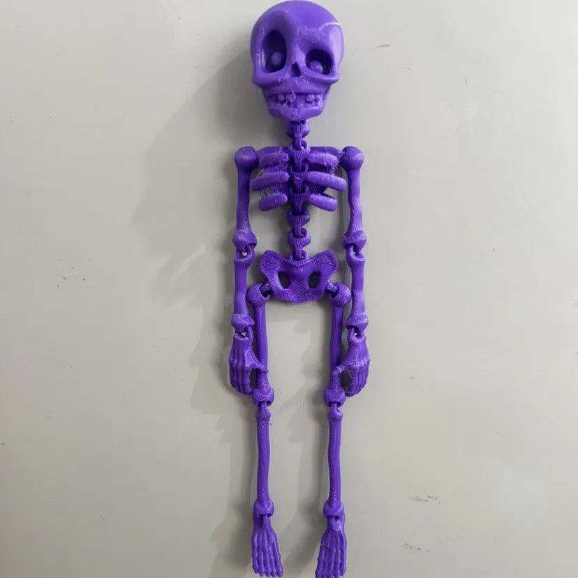 3D printed PLA skull ornament refrigerator magnet in assorted colours, 18cm high.