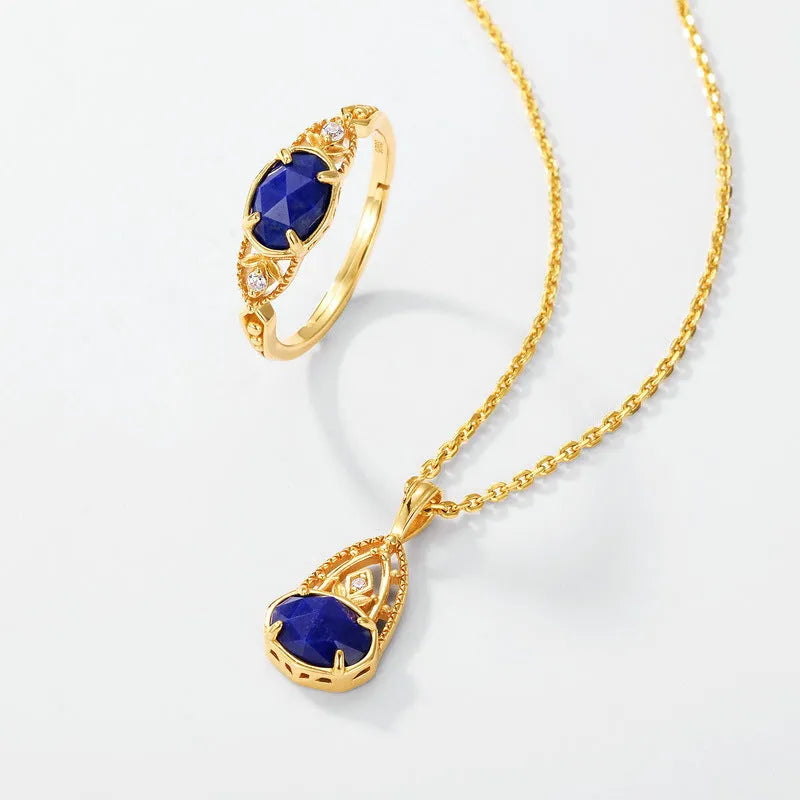 Japanese style silver alloy ring with a deep blue lapis lazuli stone in an elliptical geometric setting.