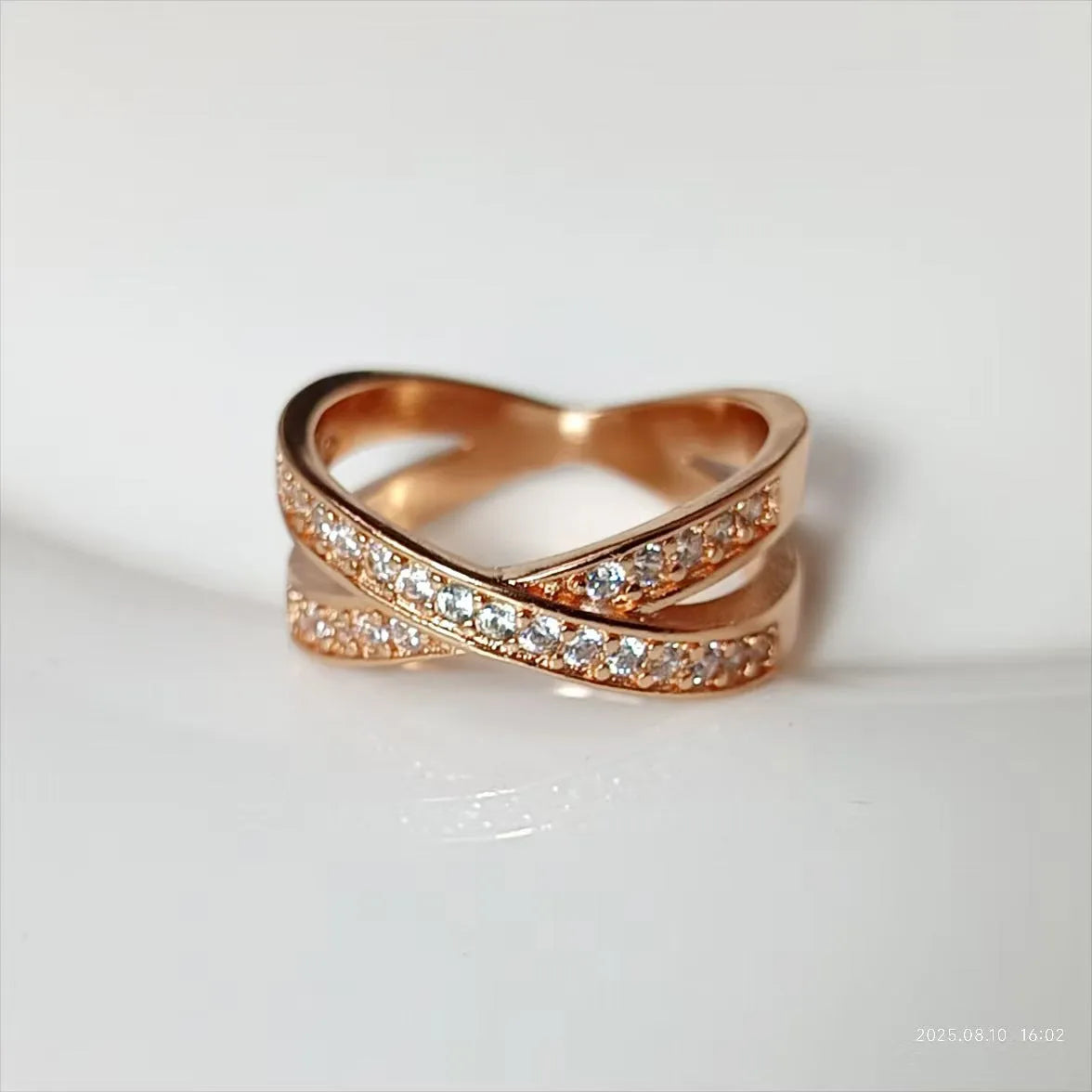 Metal cross ring with micro-inlaid zircon stones in silver or rose gold electroplate