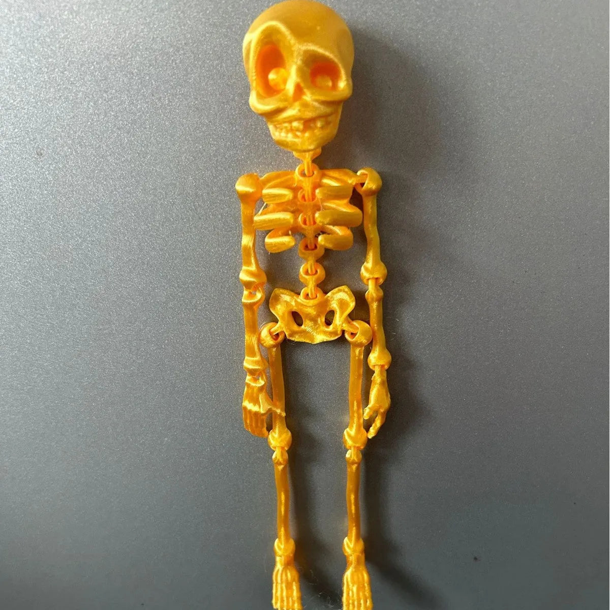 3D printed PLA skull ornament refrigerator magnet in assorted colours, 18cm high.
