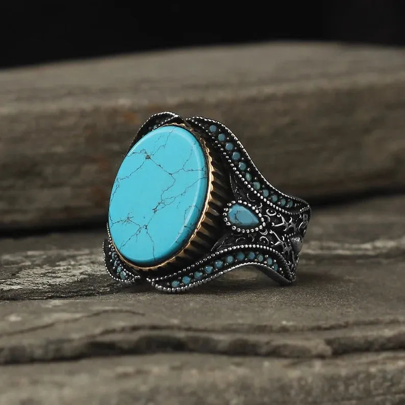 Men's round turquoise alloy ring with antique silver finish showing UK size markings