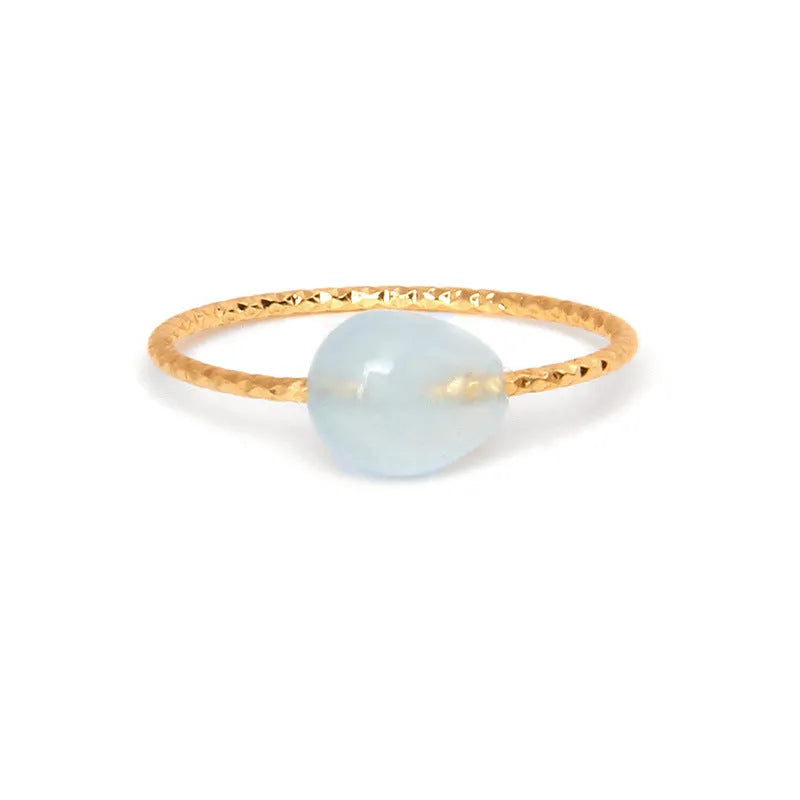 Original geometric women's agate ring on a hand, showing unique stone banding in one of eight colour options.