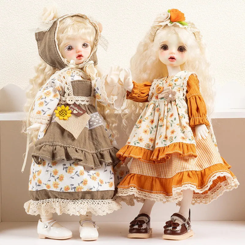 Printed cloth doll clothes for fashion dolls in various colourful patterns sold separately without dolls
