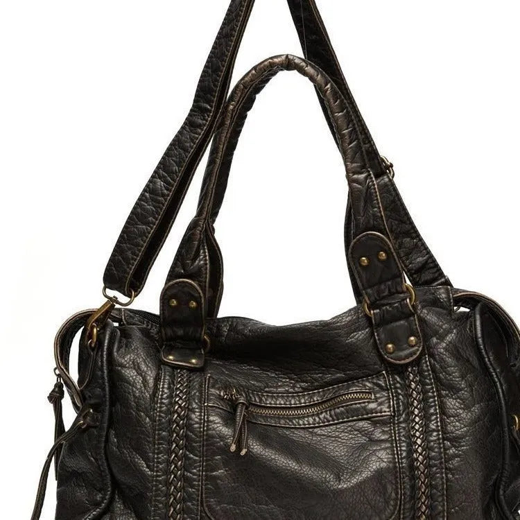 Women's retro shoulder messenger bag in soft PU leather with internal compartments and weaving detail