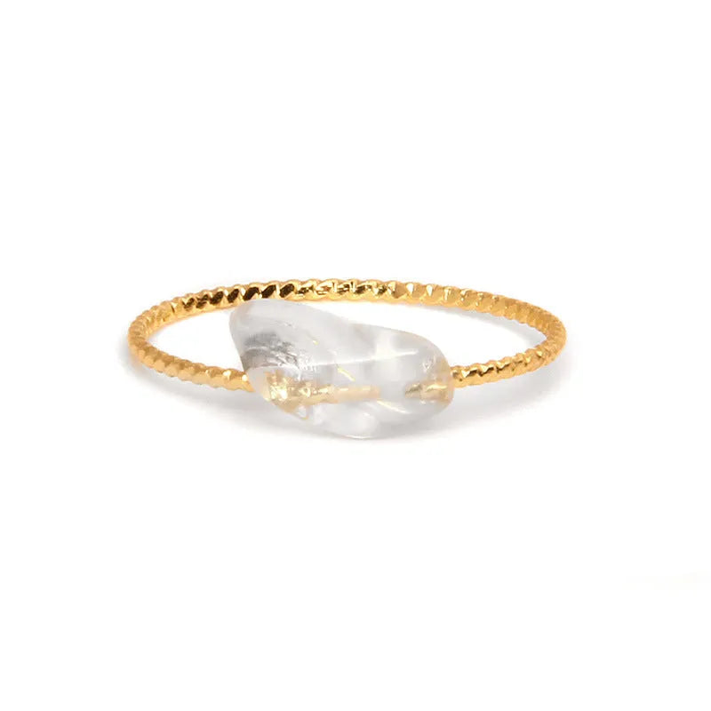 Original geometric women's agate ring on a hand, showing unique stone banding in one of eight colour options.