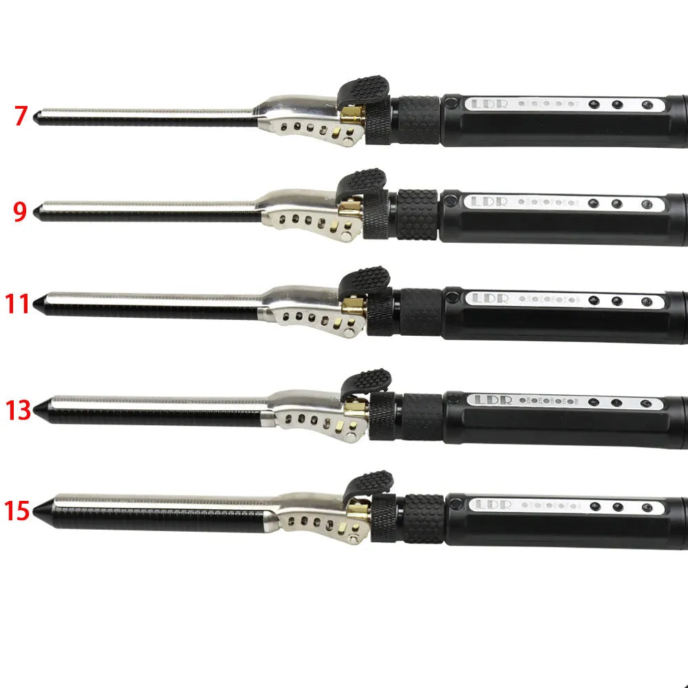 Black 7mm small hair curler with rotatable clip on a flat surface