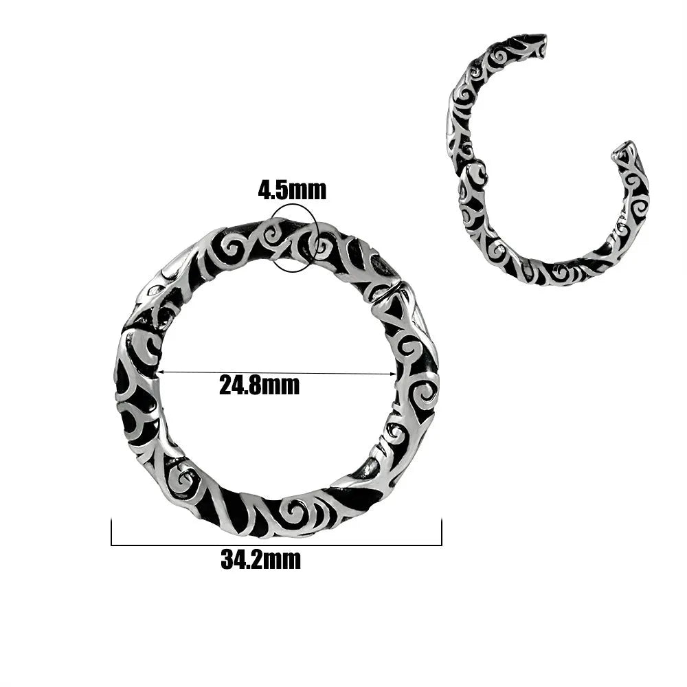 A pair of silver fashion earrings featuring a detailed totem pattern design on a stainless steel base.