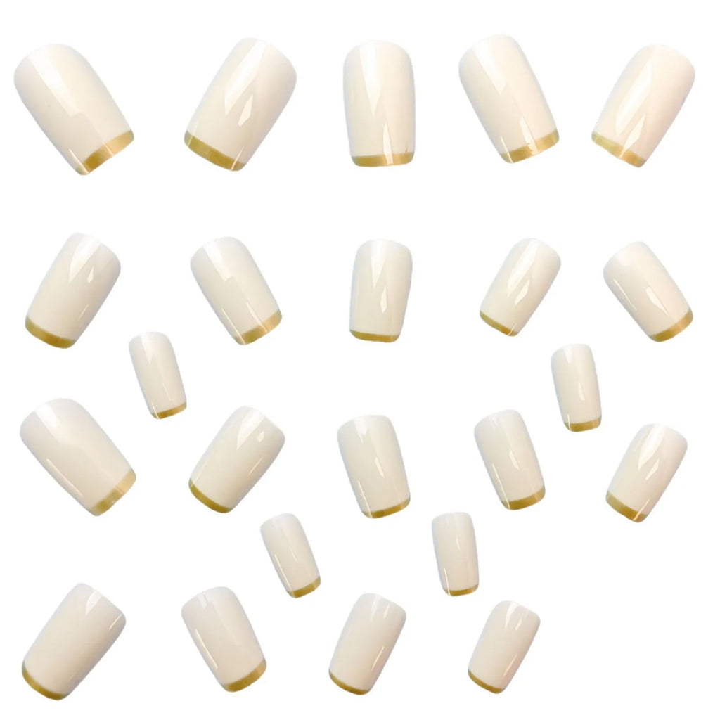 Mid-length European square nail art patch with white French tip and golden edge on a natural nail