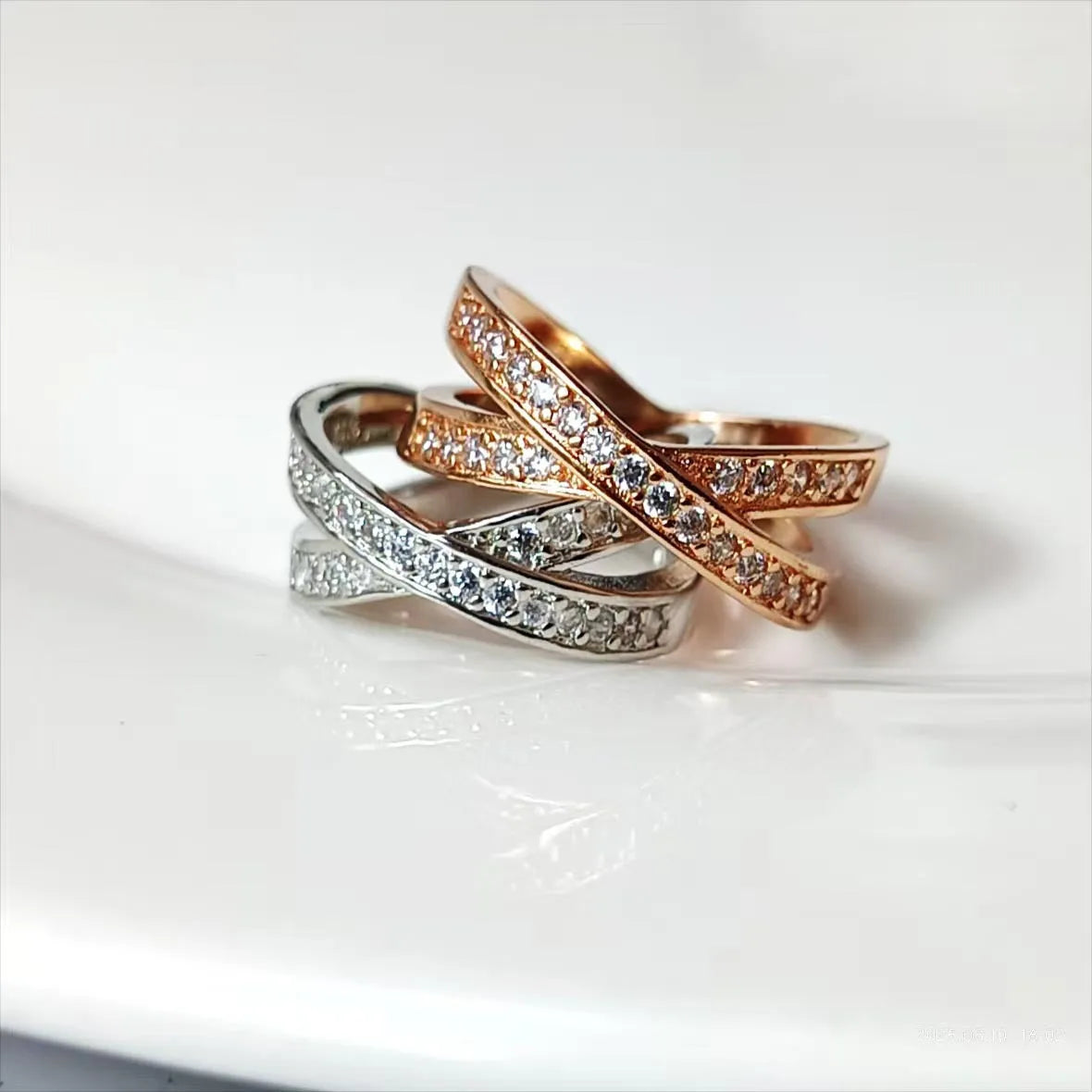 Metal cross ring with micro-inlaid zircon stones in silver or rose gold electroplate