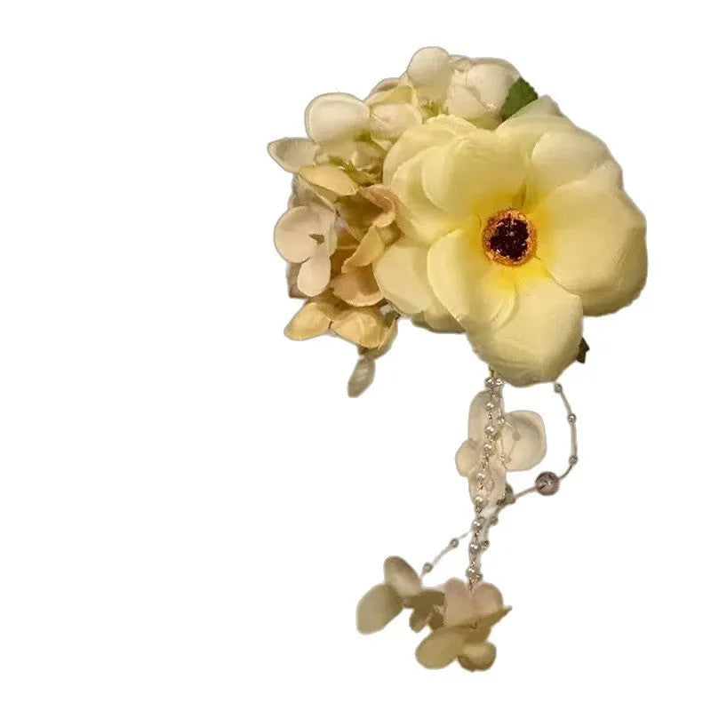 Handmade floral tassel side clip hair accessory with pearl accents in yellow or purple