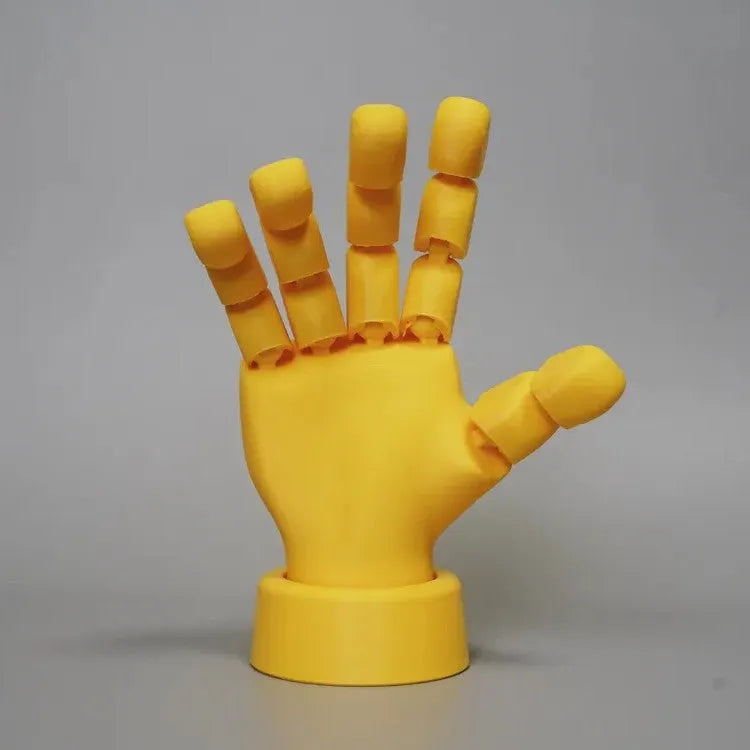 Yellow American-style hand ornament with movable joints made from PLA plastic.
