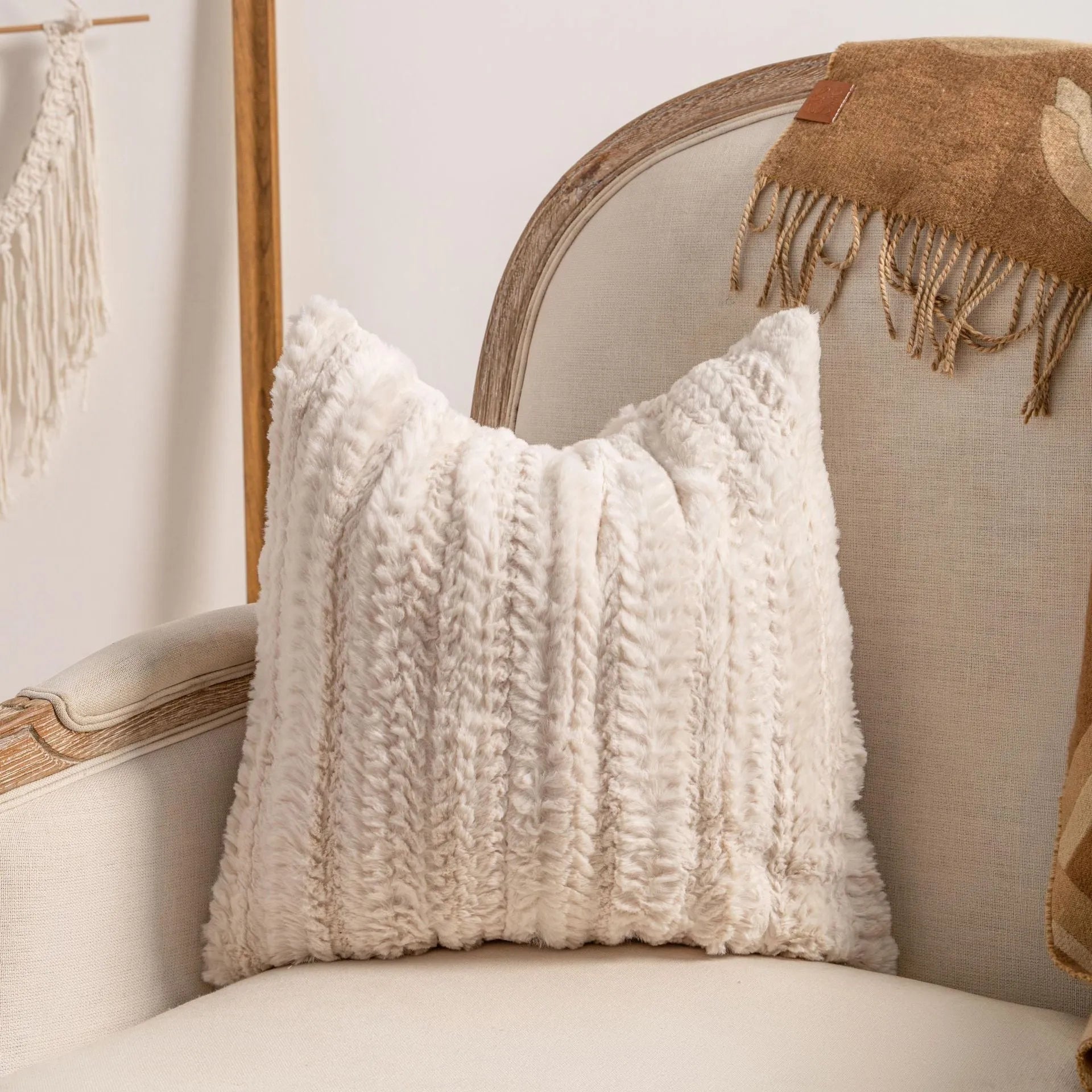 Knitted sofa cushion cover with tassel detail and striped pattern in spiral dots colour design