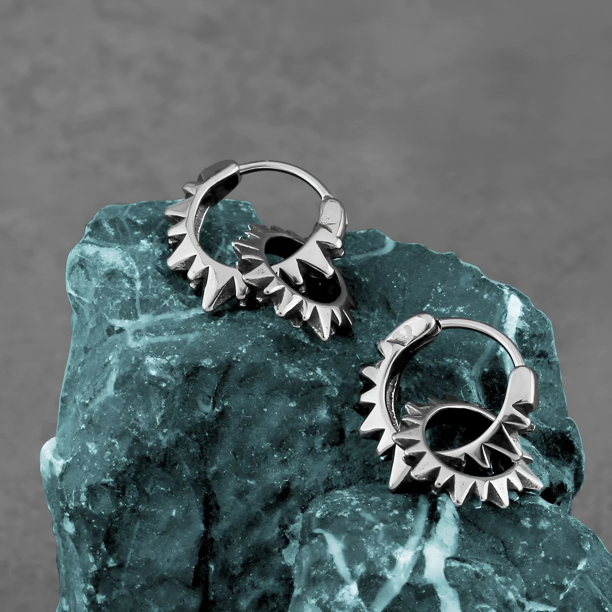 Stainless steel round ring earrings with polished steel finish and retro styling